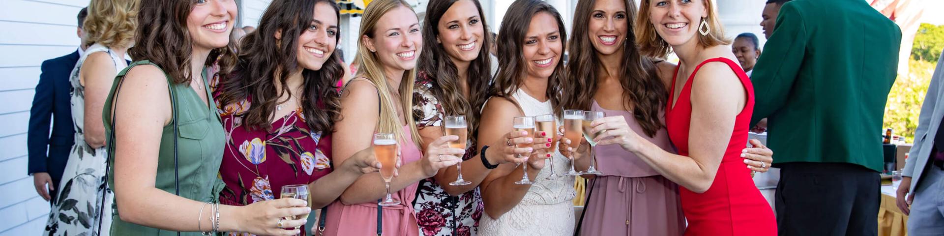 Groups of women with wine glasses on front porch