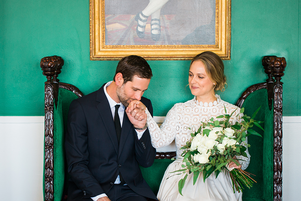 A husband kisses his wife's hand