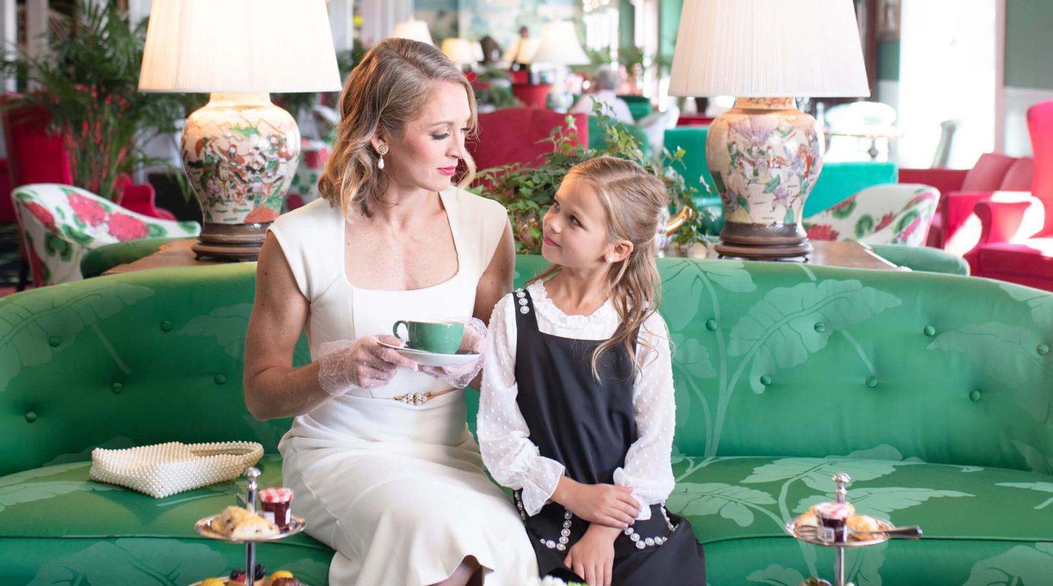 Mom and daughter enjoying afternoon tea in the parlor at Grand Hotel